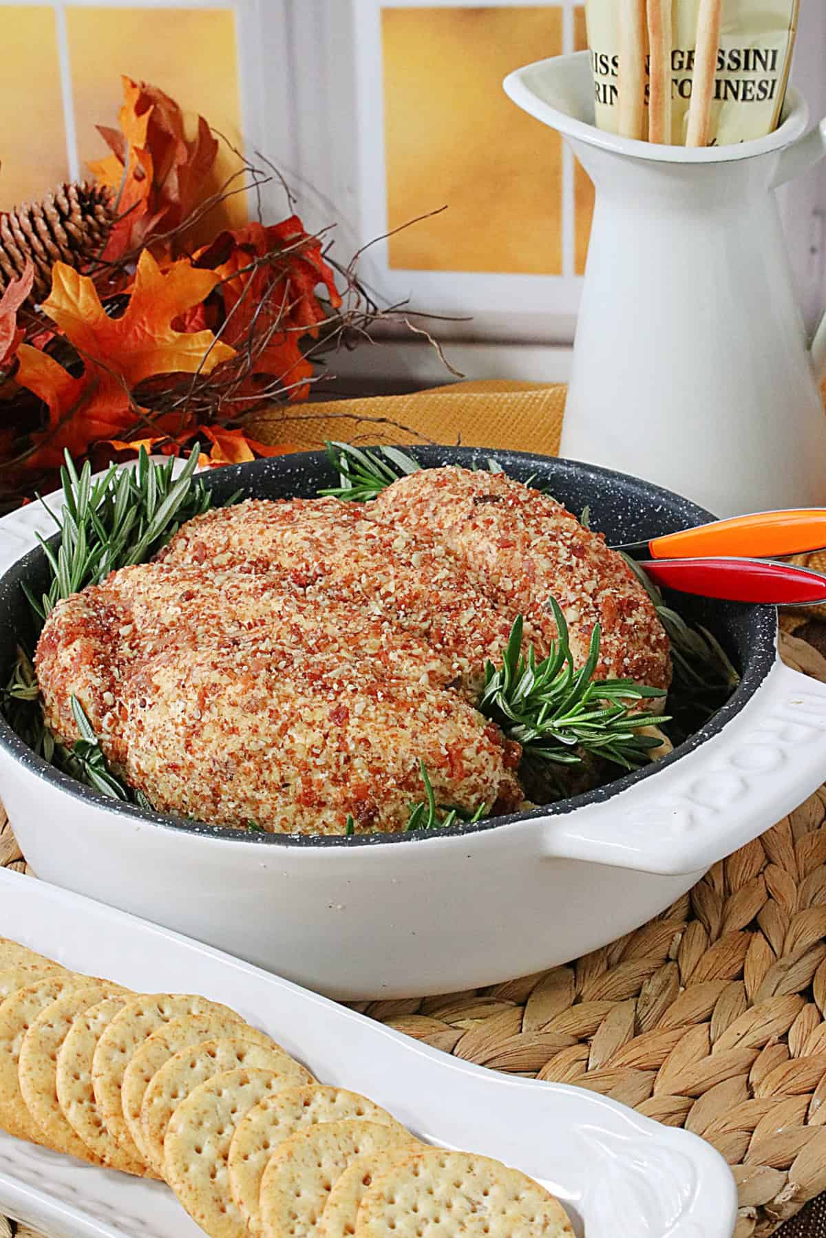 A cute looking Thanksgiving holiday cheeseball appetizer shaped like a turkey.