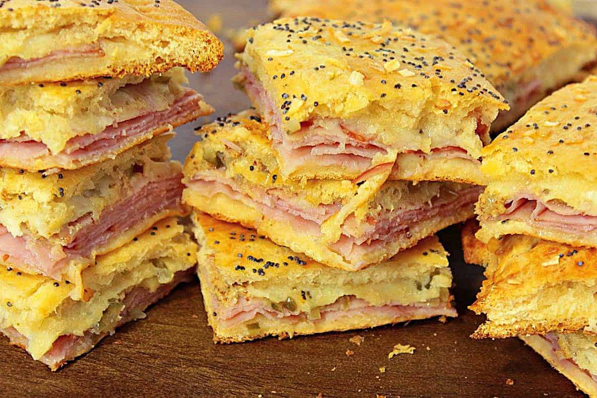 Flaky stacks of crescent roll ham and cheese appetizers cut and ready to serve.