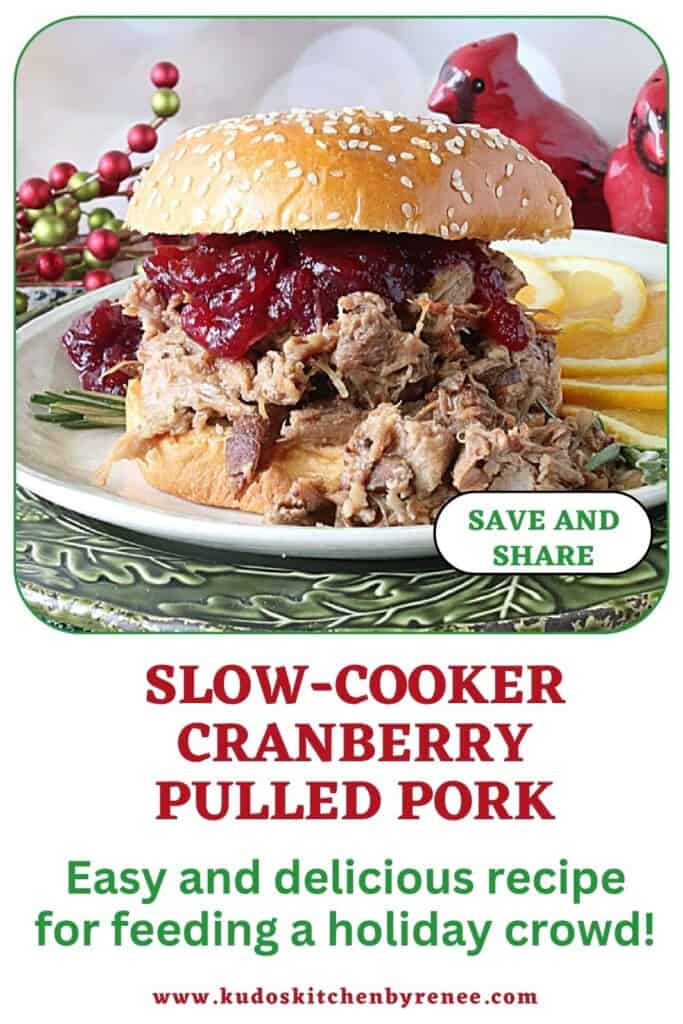 A delicious overstuffed Cranberry Pulled Pork Sandwich topped with cranberry sauce and a bun.