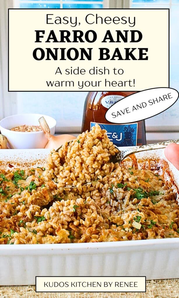 A white casserole dish filled with a farro and onion bake casserole along with a spoon.
