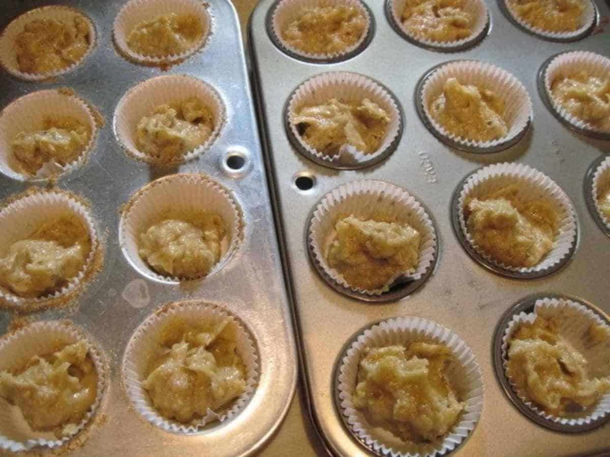 Holiday nut cup batter in mini muffin tins with paper liners.