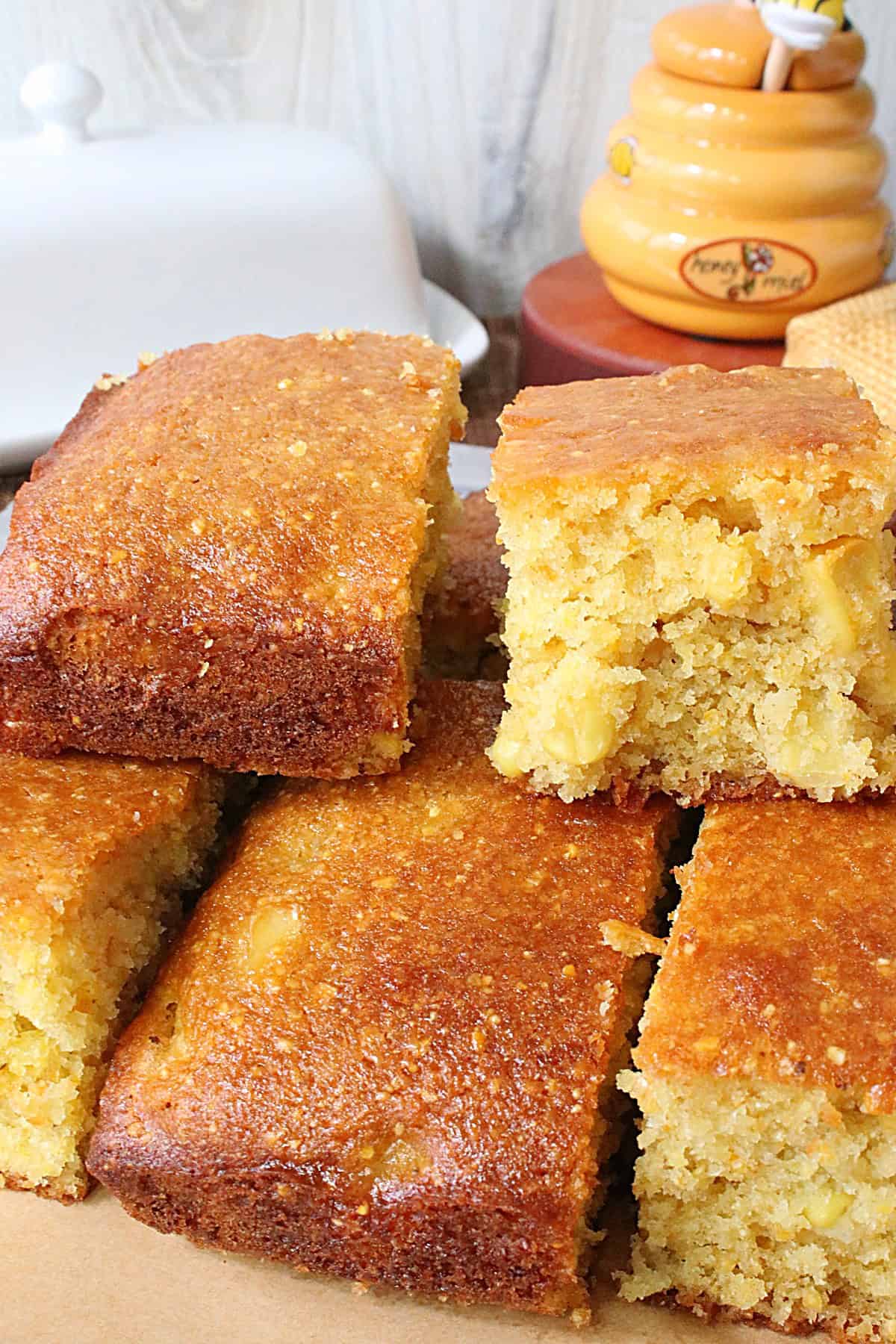 Different angles and slices of cornbread on a platter.