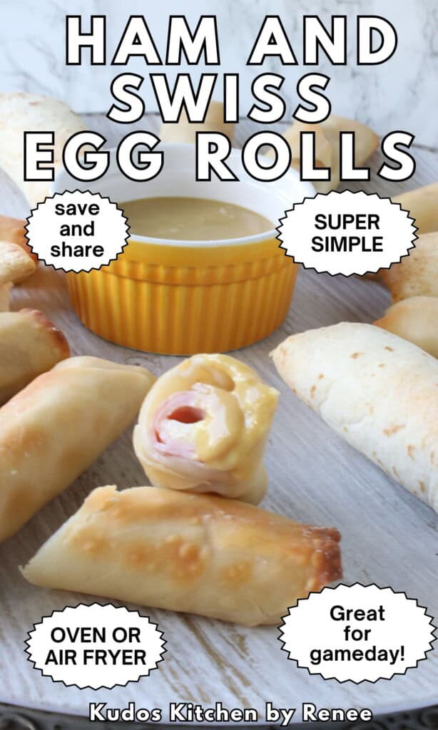 A ham and cheese egg roll that's been dipped into sauce and cut in half to show the center.