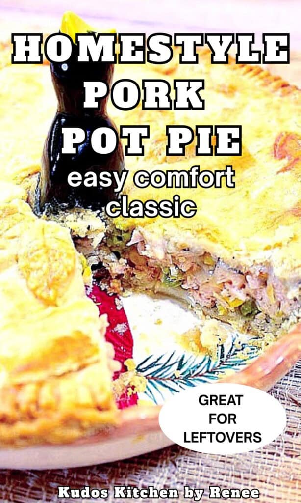 A pie bird in the middle of a pork pot pie with a slice already taken out.