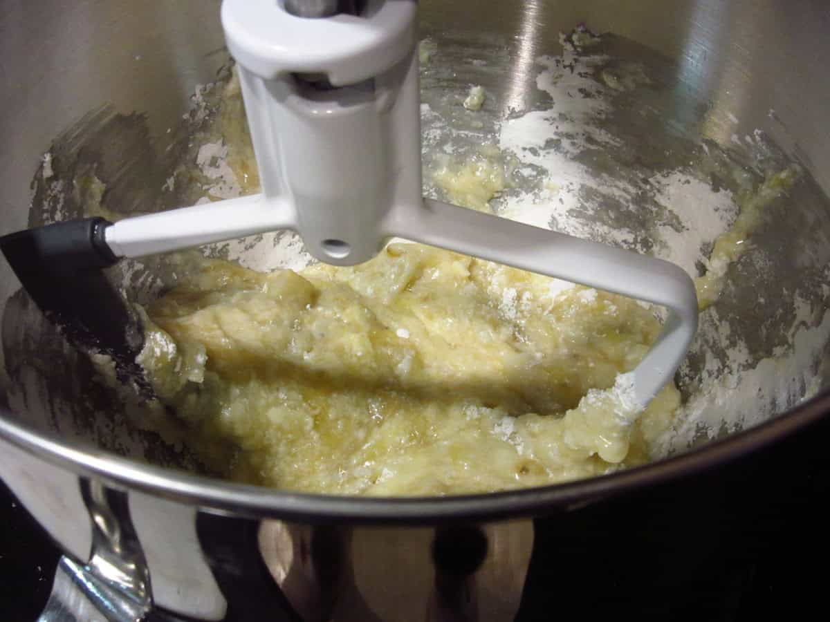 The beginnings of making banana buttercream frosting in a stand mixer bowl.