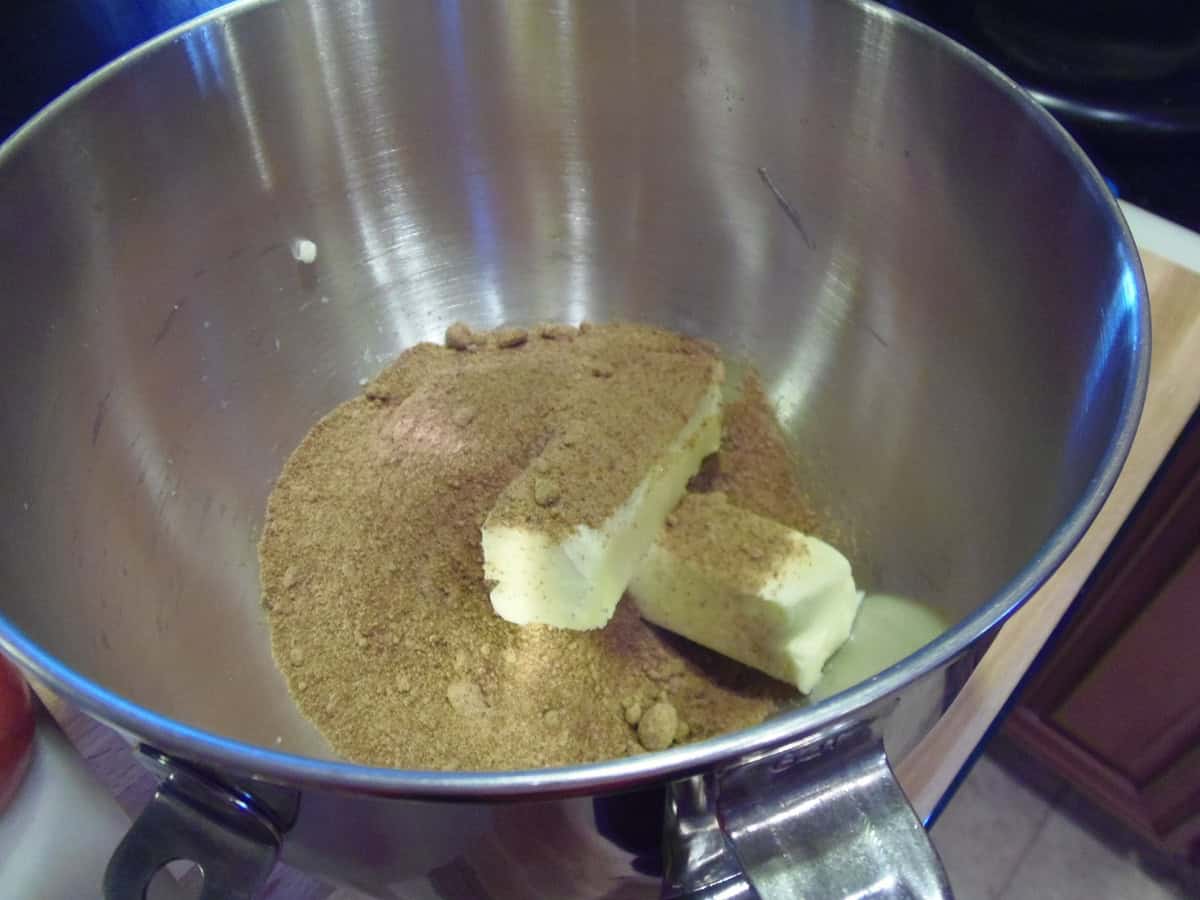 Two sticks of butter and some coconut sugar in a stand mixer bowl.