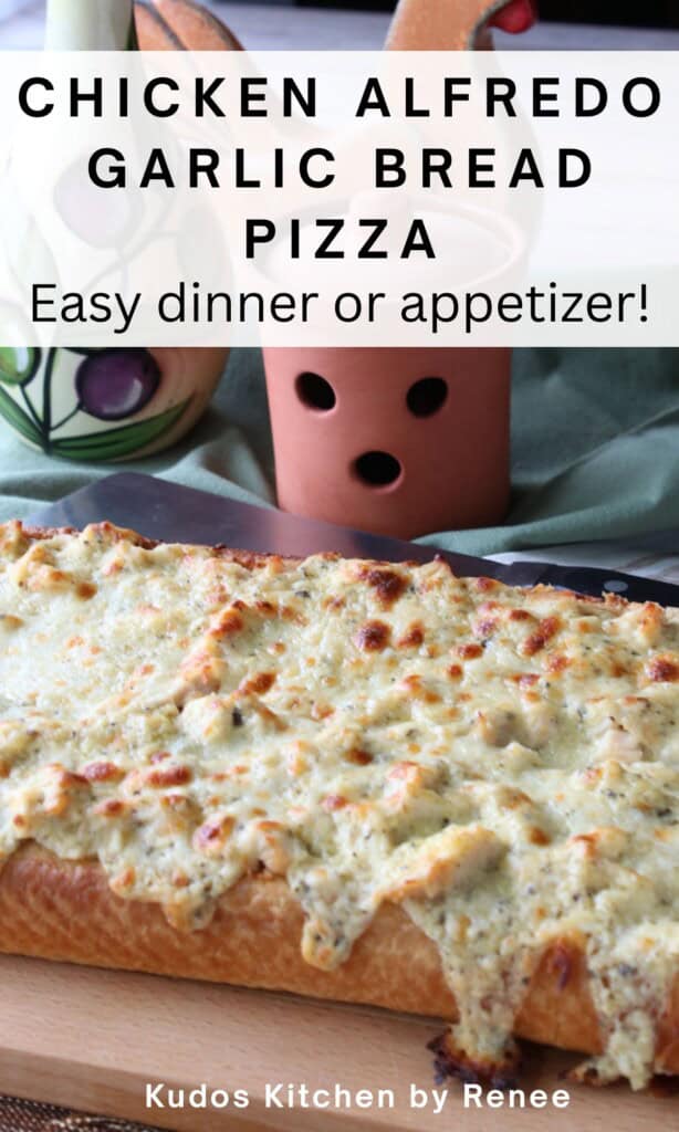 A melted cheesy, bubbly, chicken alfredo garlic bread pizza with herbs.