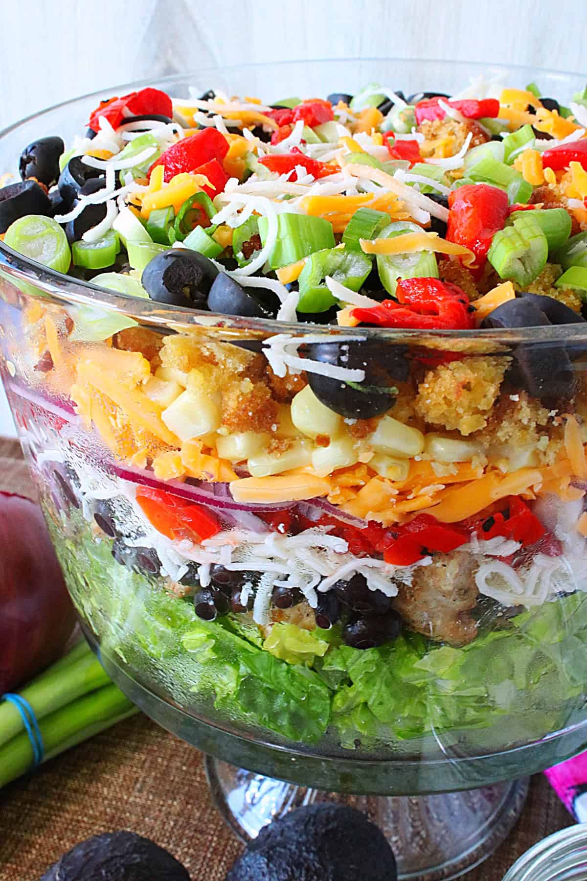 A look down into a layered salad with beautiful colors and textures.