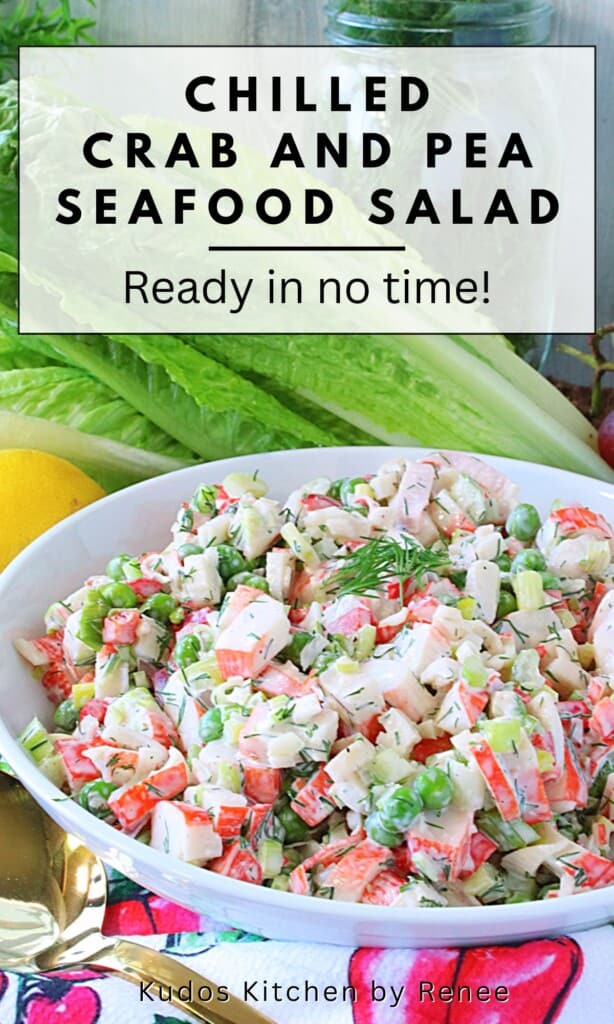 A colorful bowl of chilled crab and pea salad topped with fresh dill.