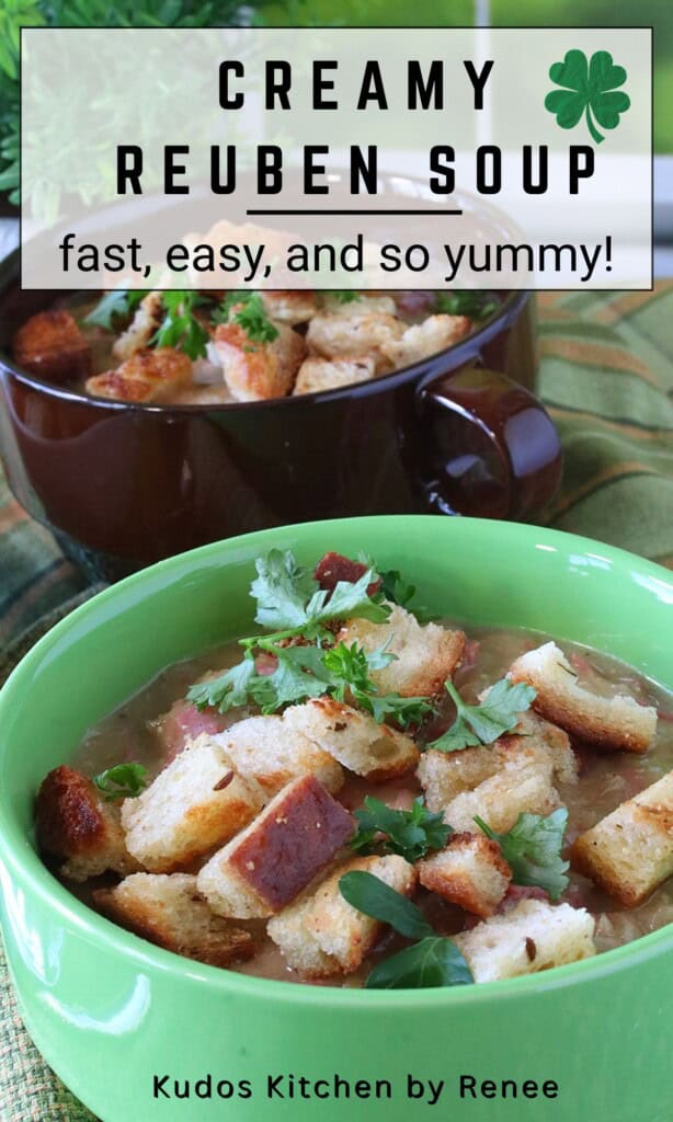 Two bowls of Reuben soup topped with rye bread croutons.