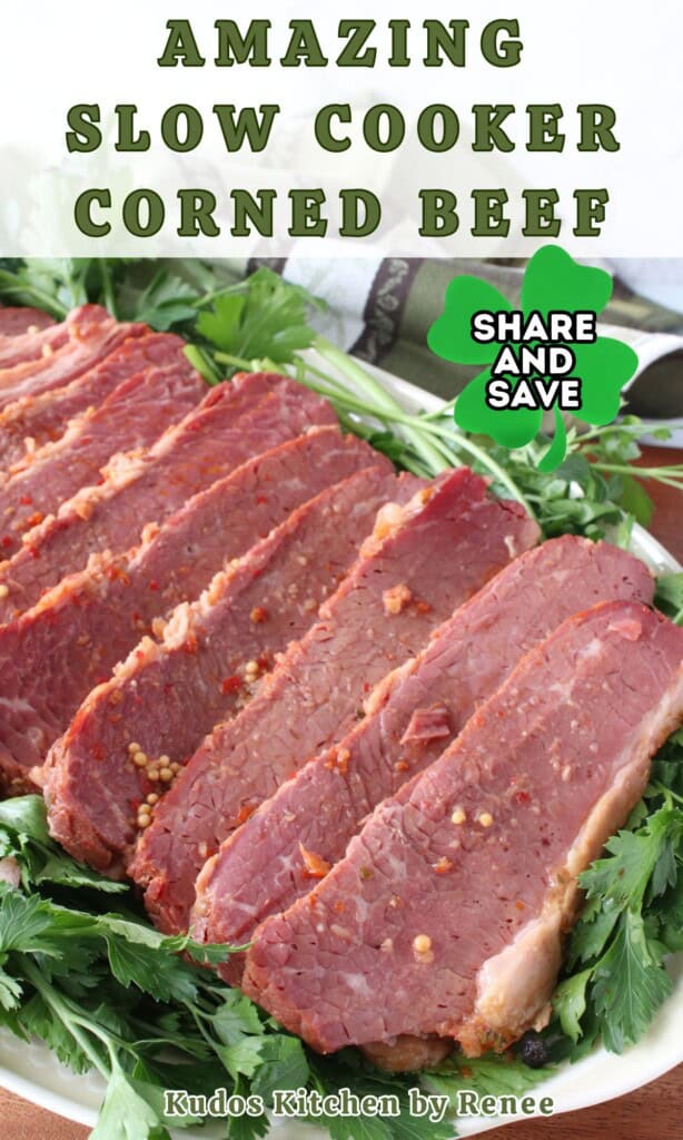 Tender, cooked slices of pink corned beef on a platter surrounded with green parsley.