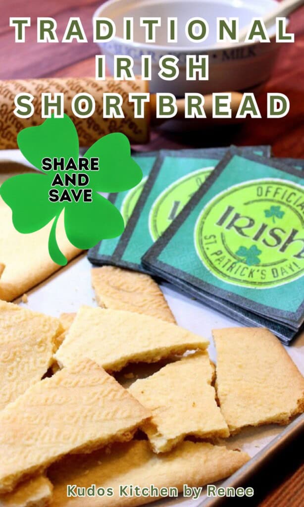 A pile of hand-broken pieces of Irish shortbread on a baking sheet with Irish napkins in the background.