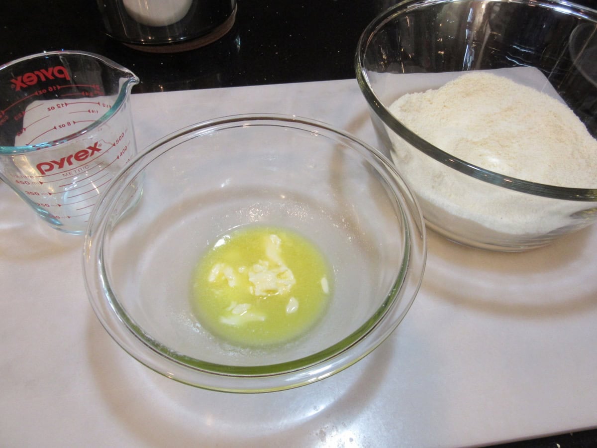 Melted butter in a glass bowl.