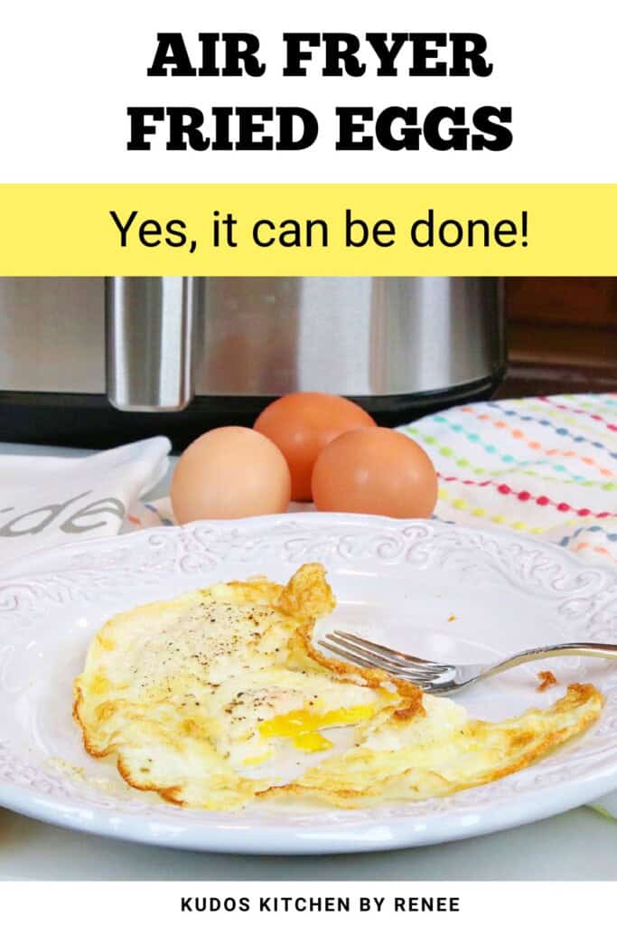 A fried egg on a white plate with a fork and an air fryer with three eggs in the background.