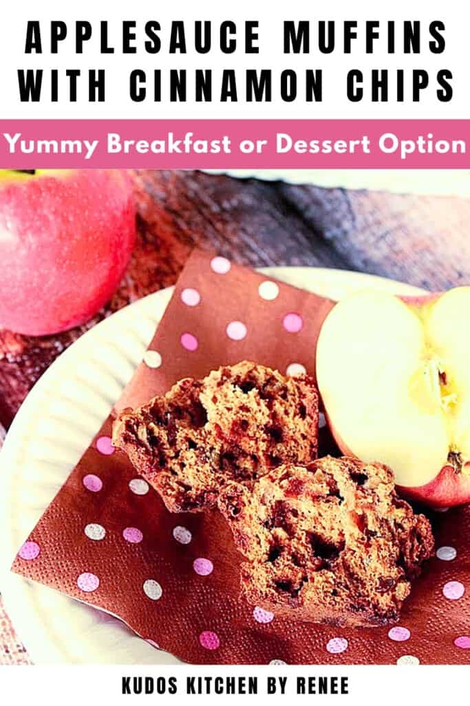 An applesauce muffin broken in half on a brown and pink polka dot napkin on a white plate.
