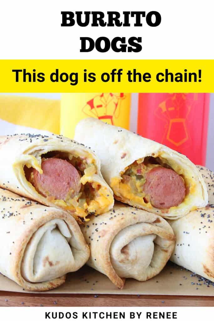 A stack of burrito dogs on a board with ketchup and mustard bottles in the background.