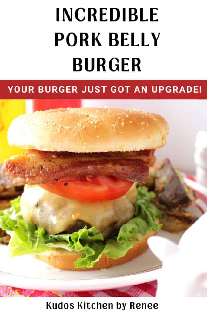 A delicious looking burger with a thick slice of pork belly on top along with lettuce, tomato and cheese.