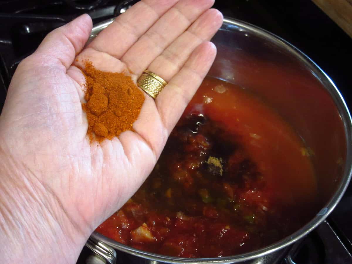 Smoked paprika in the palm of a hand.