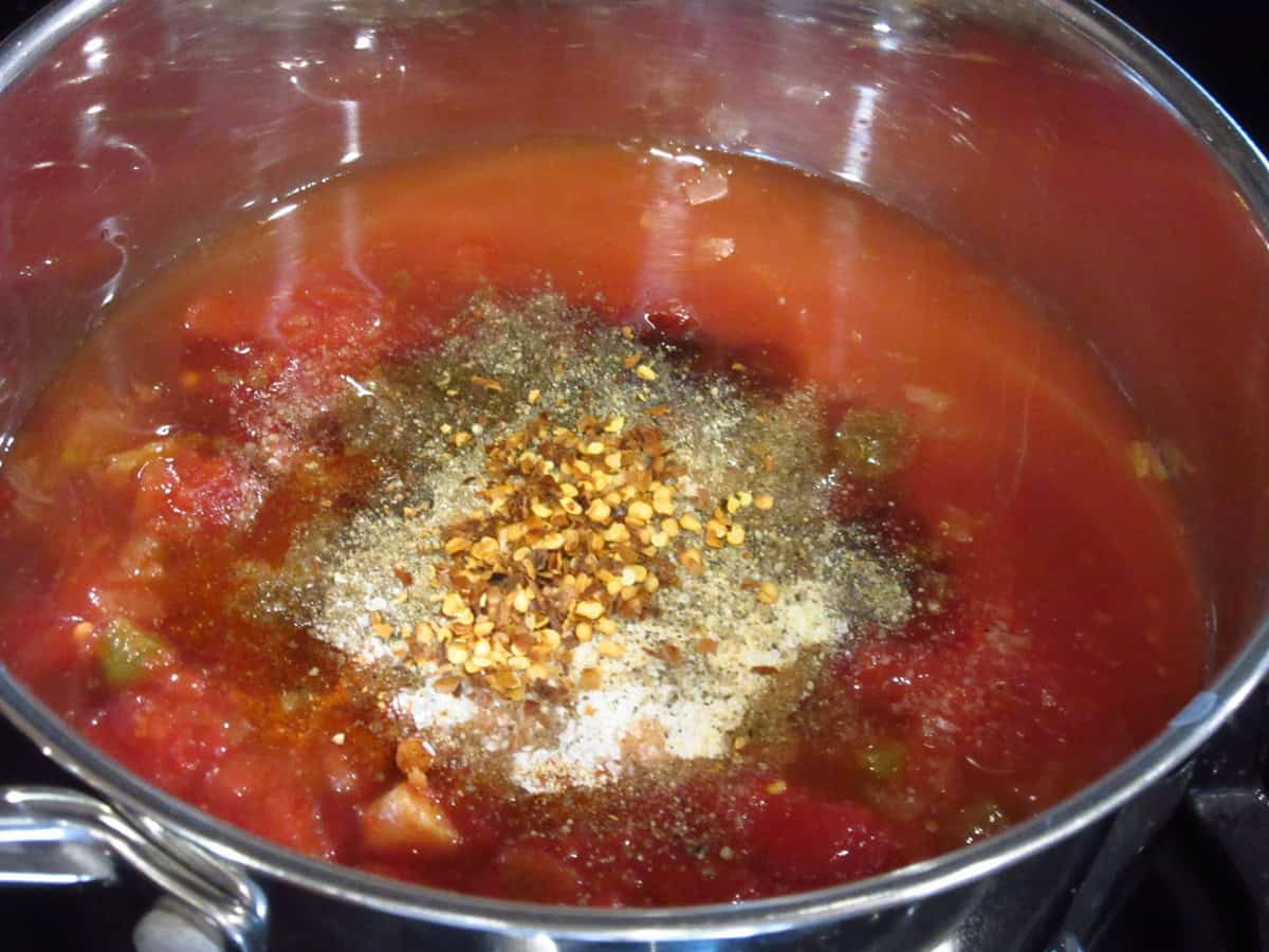 The seasonings in the salsa BBQ sauce saucepan before cooking.
