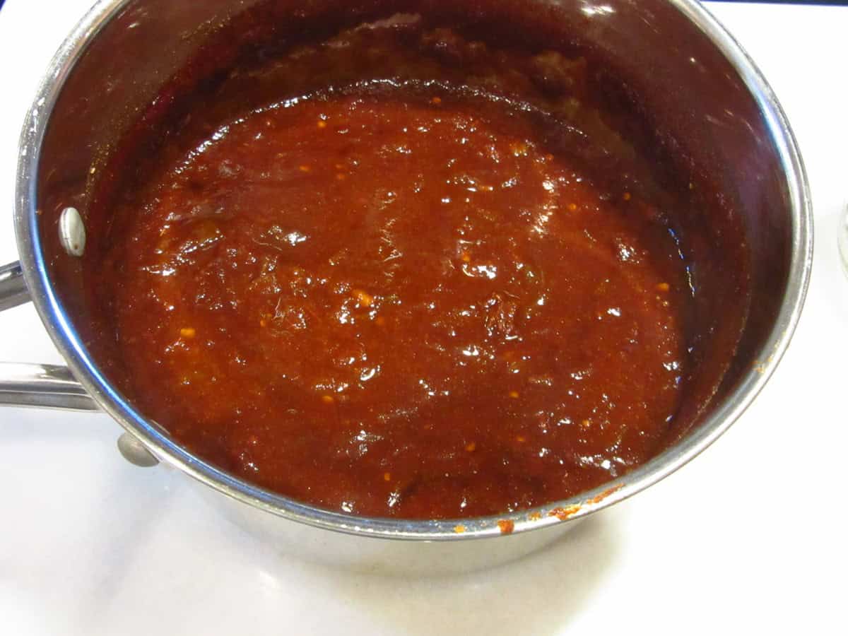 Salsa in a saucepan on the counter.