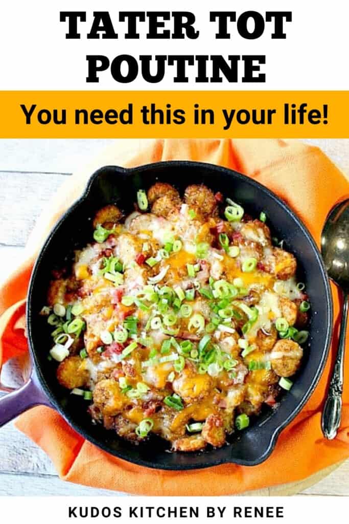 A purple skillet filled with cheesy tater tot poutine topped with ham, scallions, and gravy.