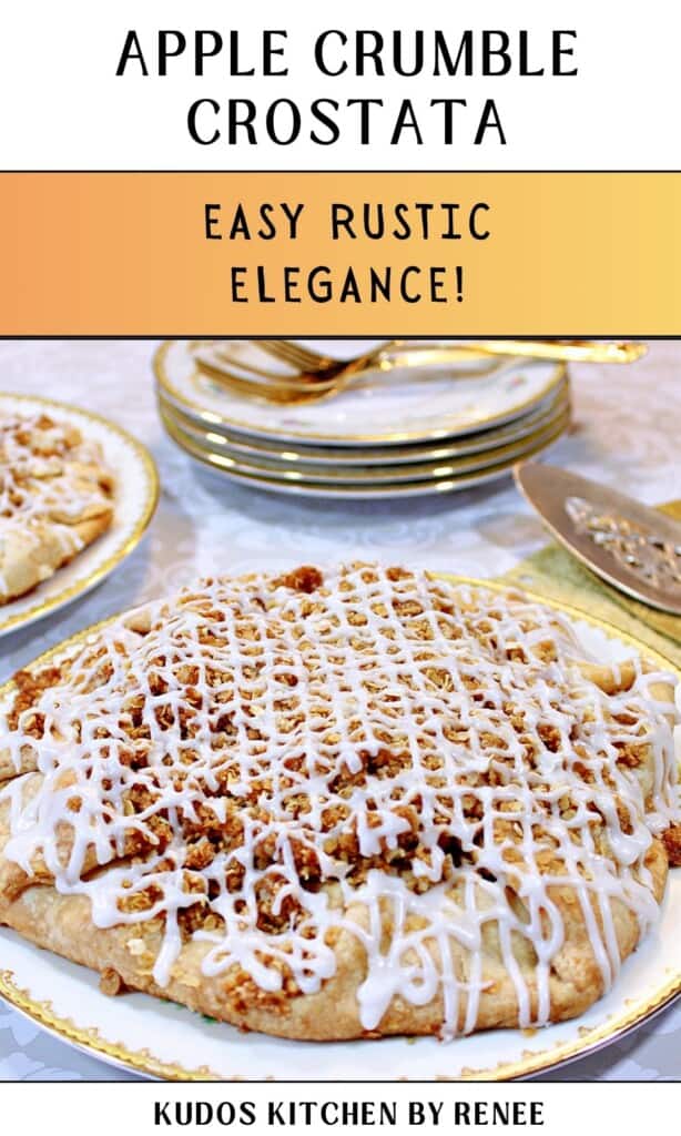 A pretty apple crumble crostata drizzled with icing on a pretty porcelain plate.