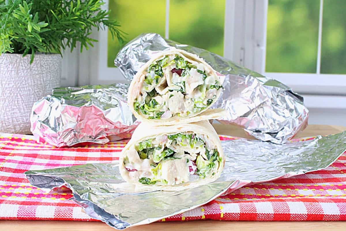 The inside view of a chicken Caesar salad wrap.