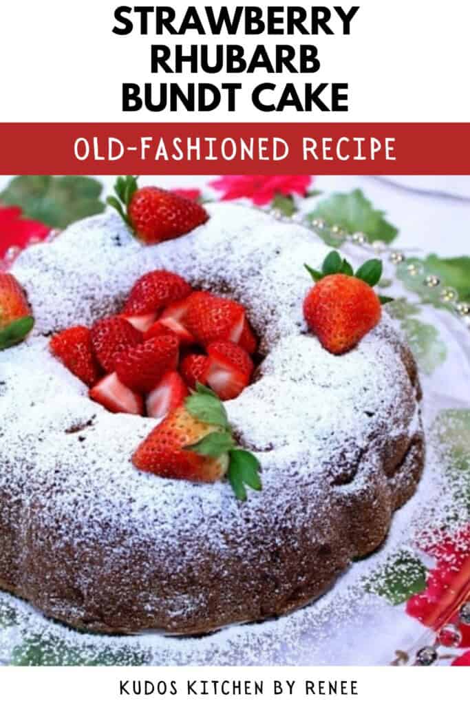 A powdered sugar dusted Bundt cake topped with beautiful fresh strawberries.