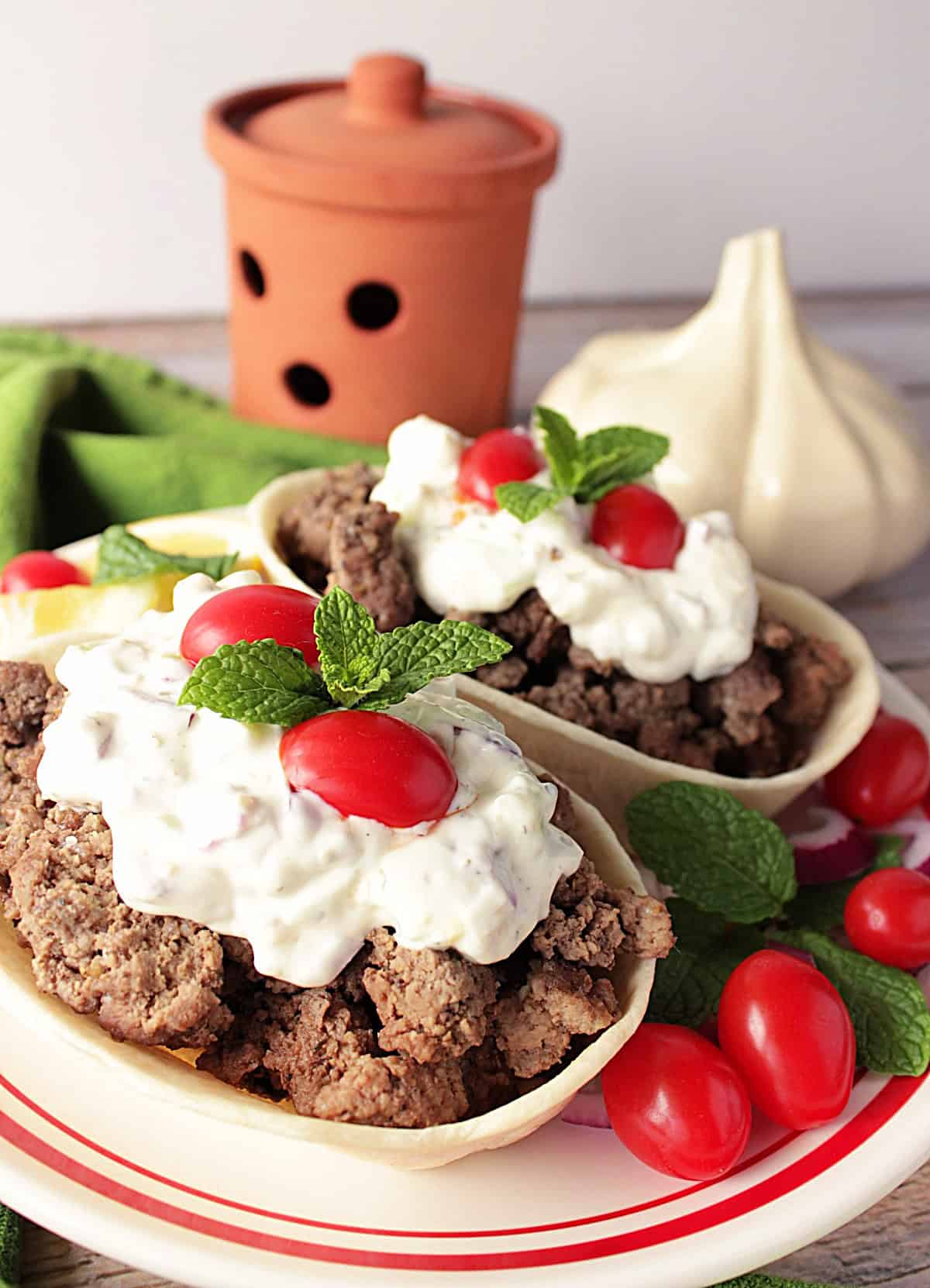 Sloppy Gyros Tortilla Boats are seasoned ground lamb piled high in a flour tortilla boats and then topped with cool, creamy tzatziki sauce. - www.kudoskitchenbyrenee.com