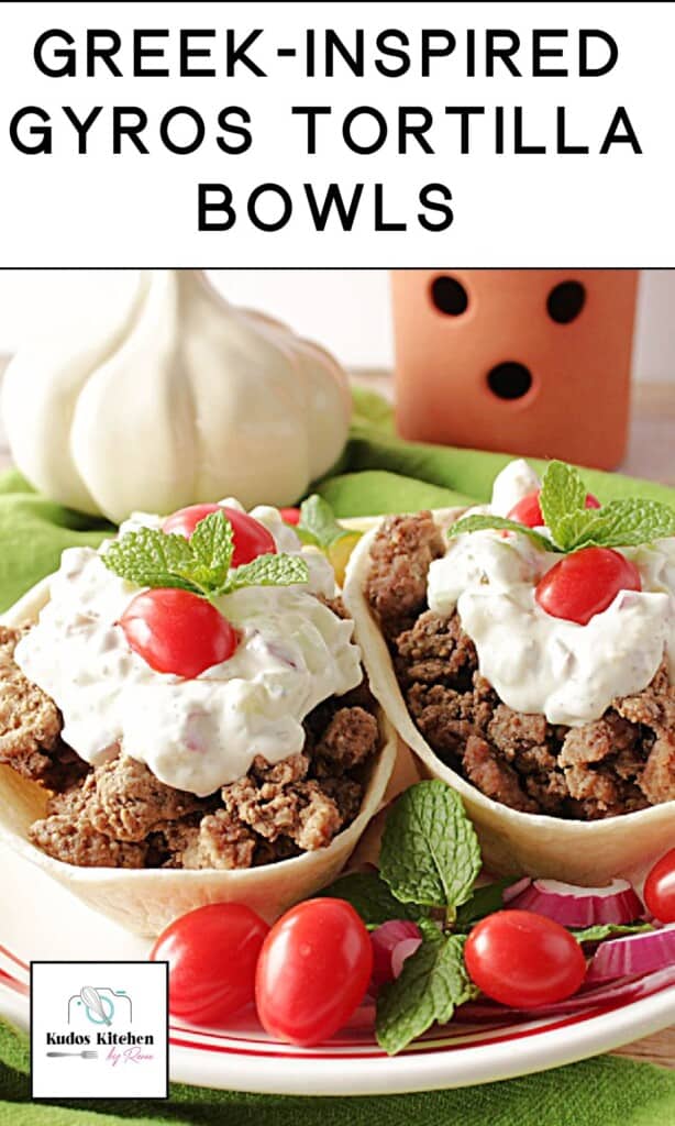 Two Greek Sloppy Gyros Bowls on a plate topped with tzatziki.