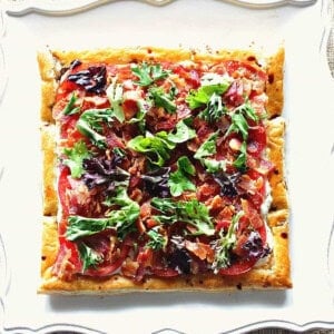 A square photo of a BLT Puff Pastry Sandwich Tart before slicing and serving.