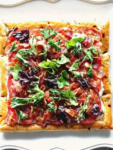 A square photo of a BLT Puff Pastry Sandwich Tart before slicing and serving.