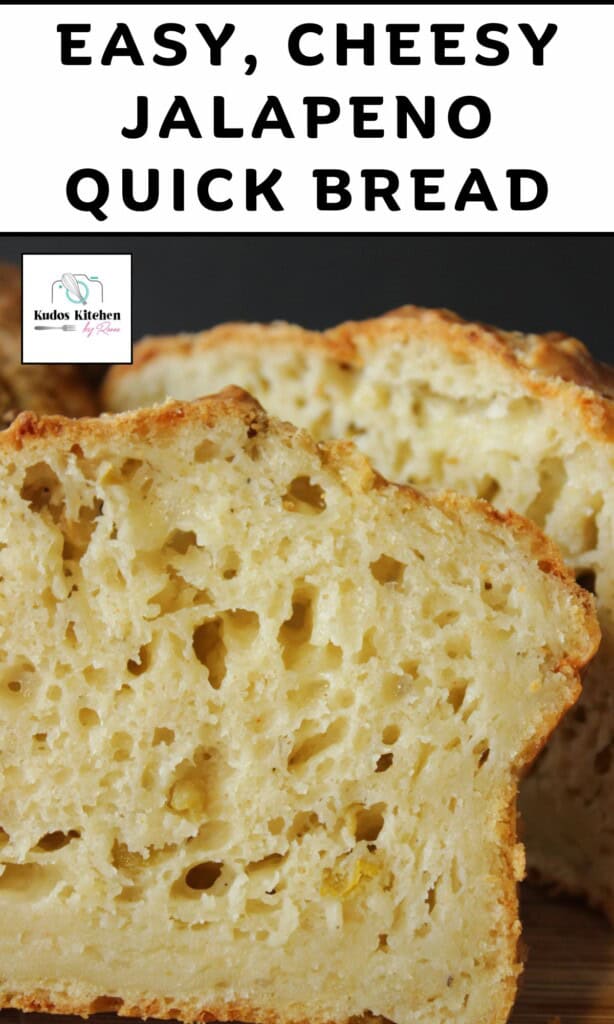 A look inside a baked loaf of cheesy jalapeno quick bread with the structure and texture visible.