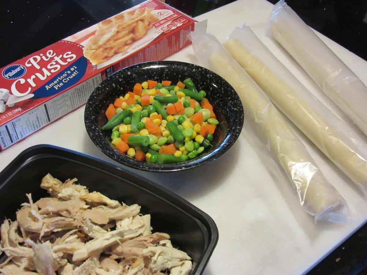 The ingredients for making chicken pot pie pockets out on the countertop.