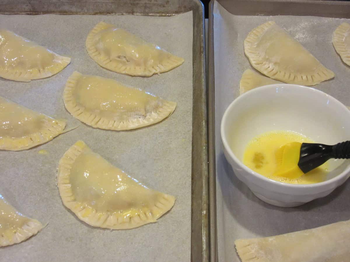 An egg wash in a bowl for brushing on chicken pot pie pockets with pie dough.