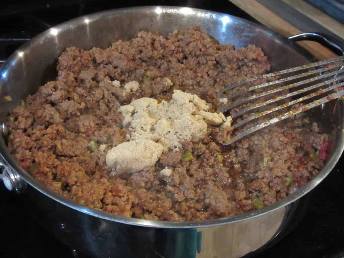 Brown sugar in a skillet with the meat mixture for making sloppy Joes.