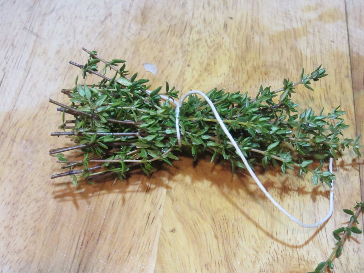 A bunch of thyme sprigs tied with cooking twine.