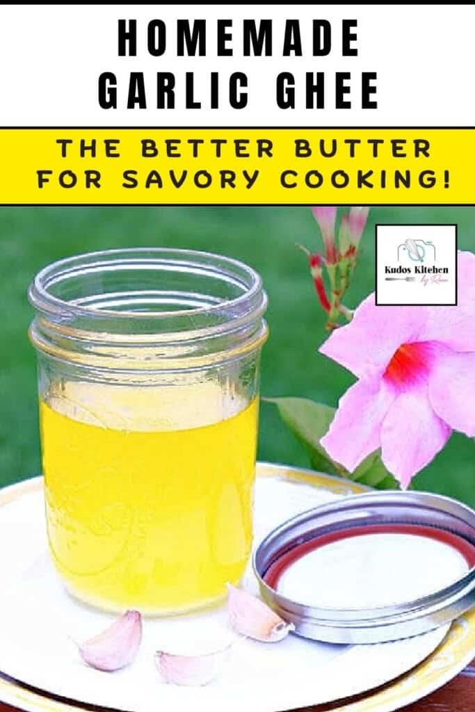 A mason jar with homemade garlic ghee inside and garlic cloves on a plate.