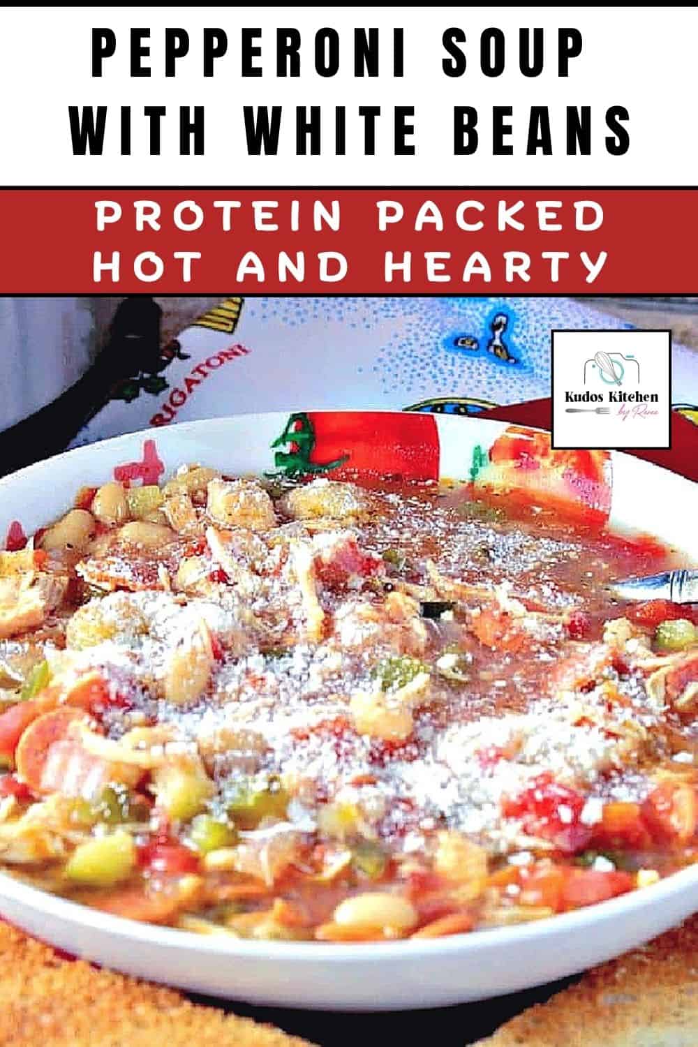 A serving of Italian pepperoni soup with white beans and veggies in a white soup bowl.