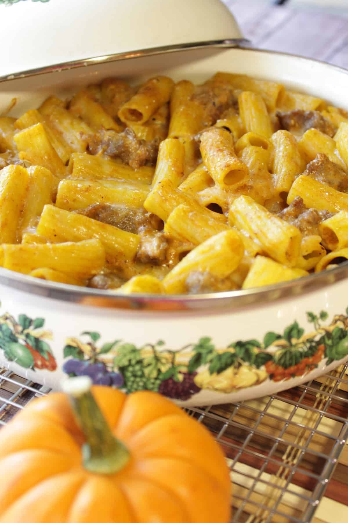 Creamy pumpkin cream cheese sauce pasta over rigatoni and crumbled bratwurst.