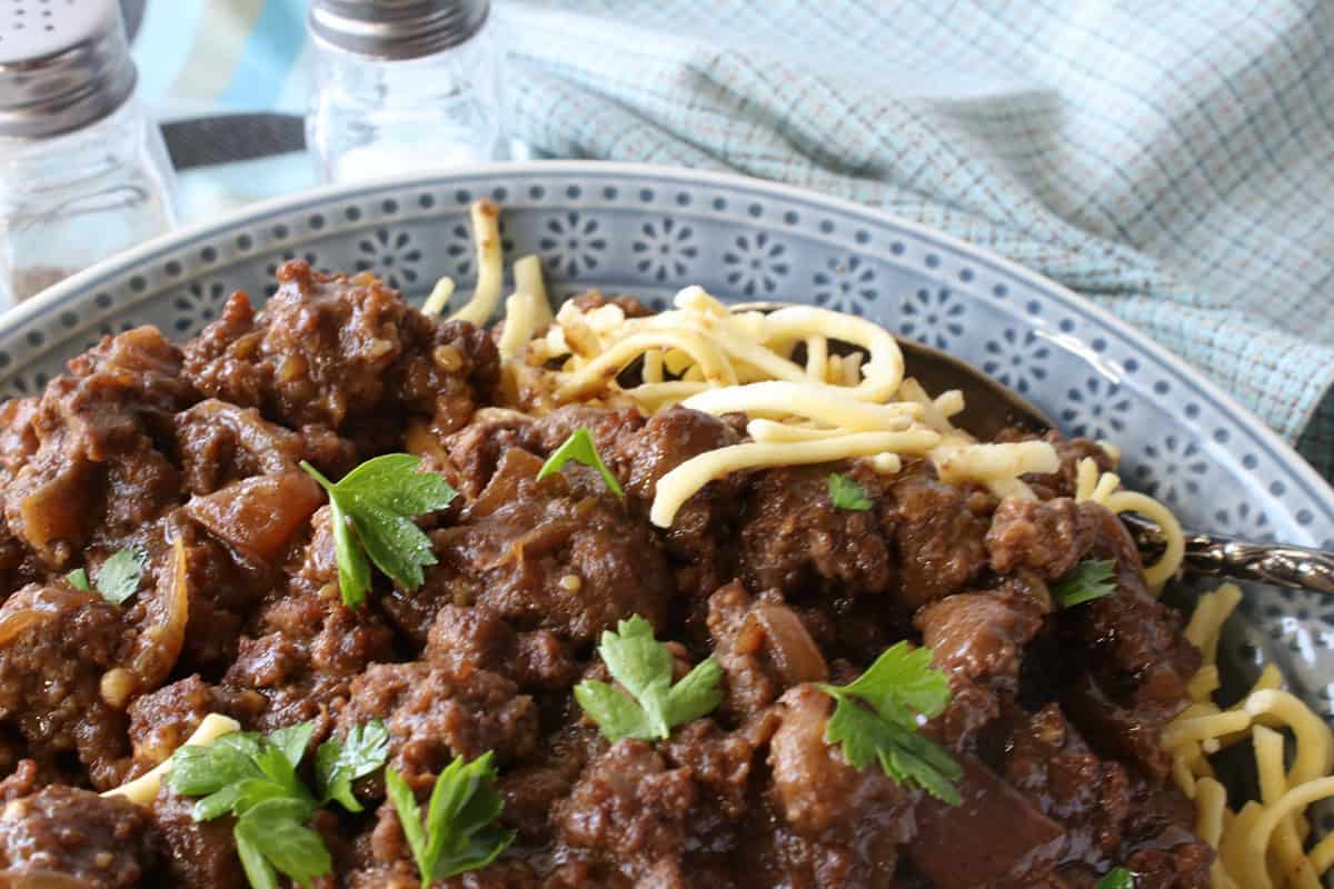 Spaetzle noodles covered with a rich, brown ground beef sauerbraten sauce.