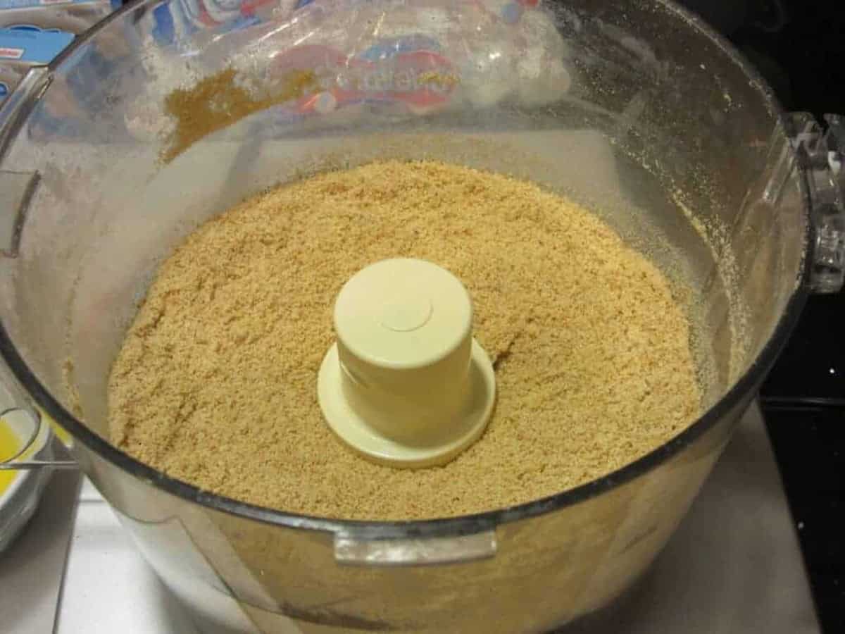 Crushed graham crackers in a food processor.
