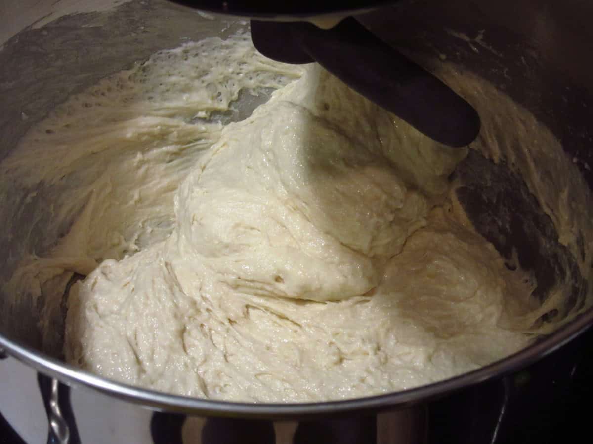 Wet English muffin dough after the baking soda and water solution has been mixed in.