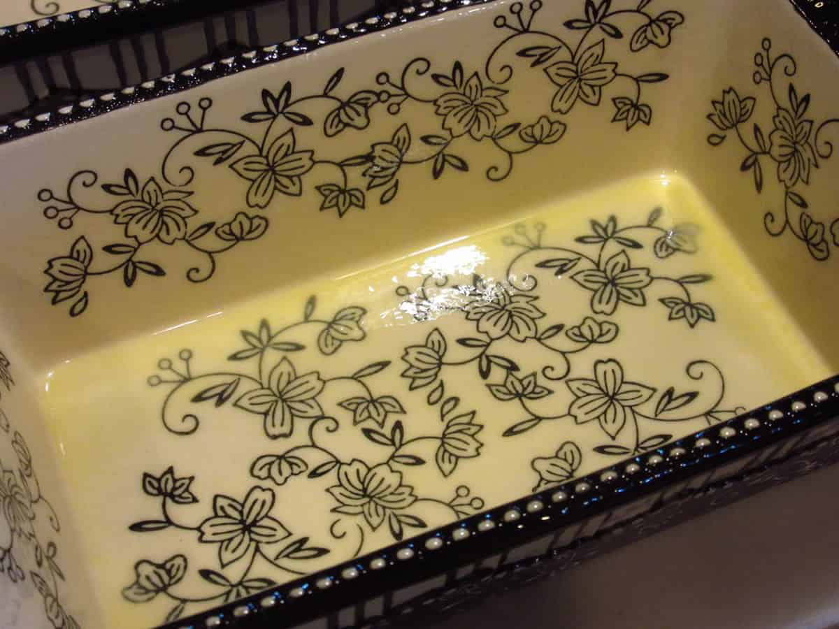 An oiled ceramic loaf pan.
