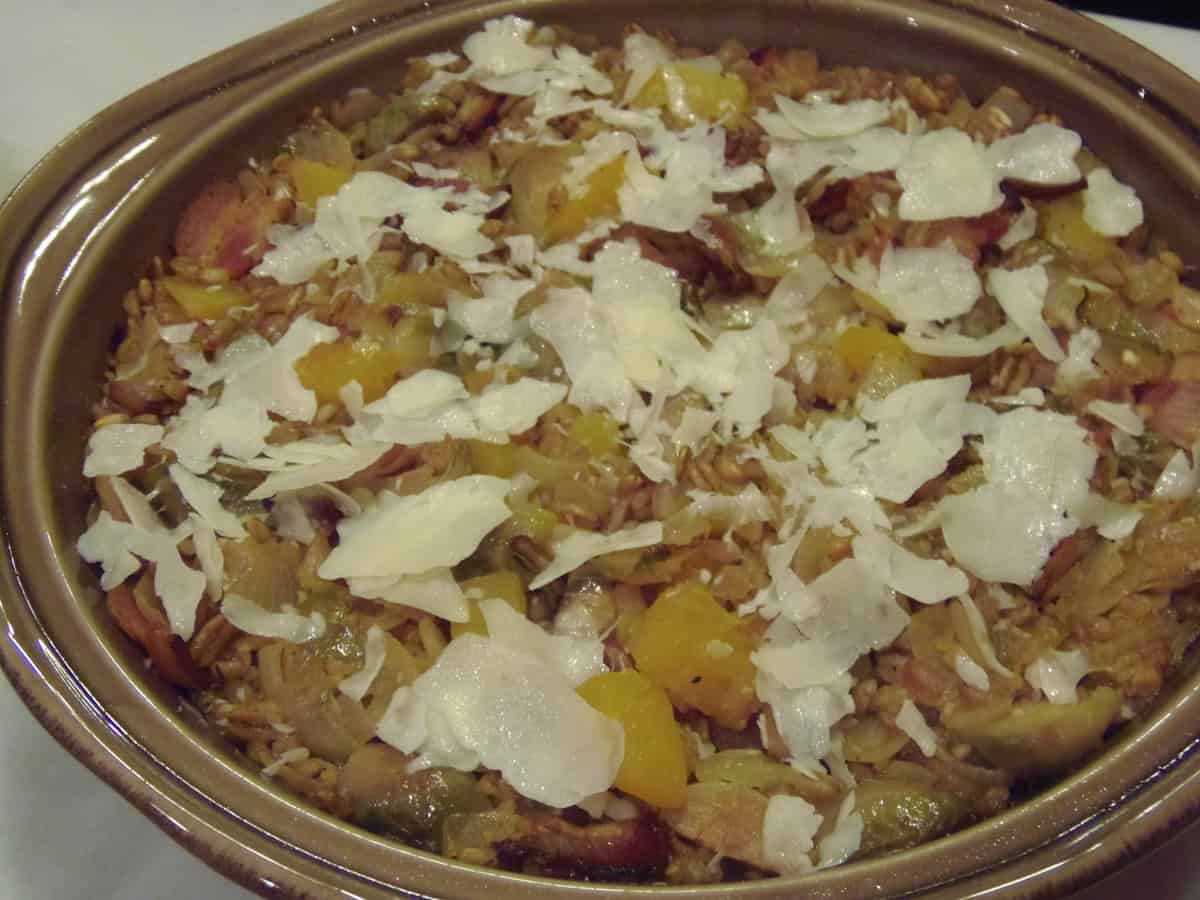Parmesan cheese topped farro casserole before going in the oven.