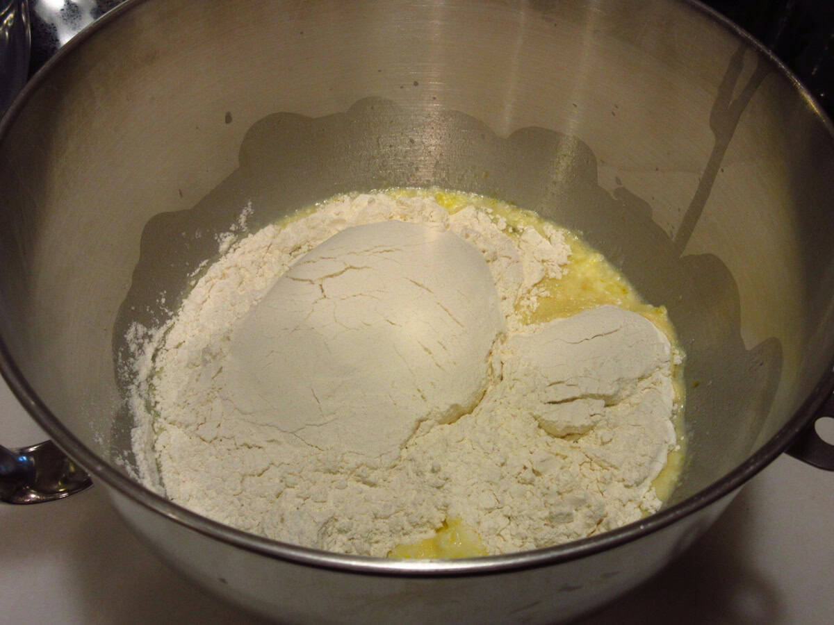 All-Purpose flour in a stand mixer bowl with milk, butter and eggs to make batter bread.